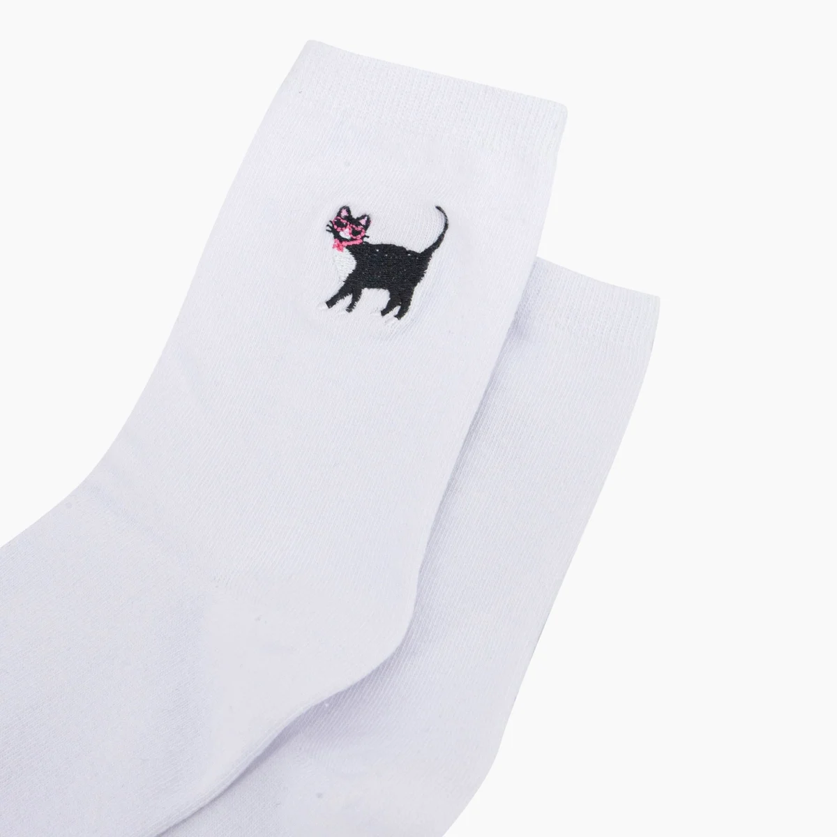 white cat socks up close