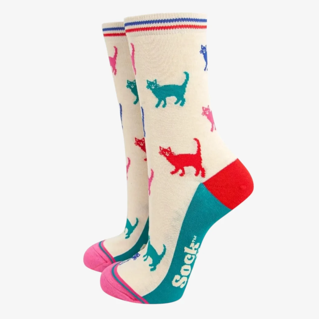 Cream ankle socks with pink, blue, and red cat silhouettes